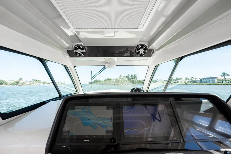 4 Reels Yacht Photos Pics Interior view of 2021 Grady-White Canyon 456 boat with advanced navigation system.