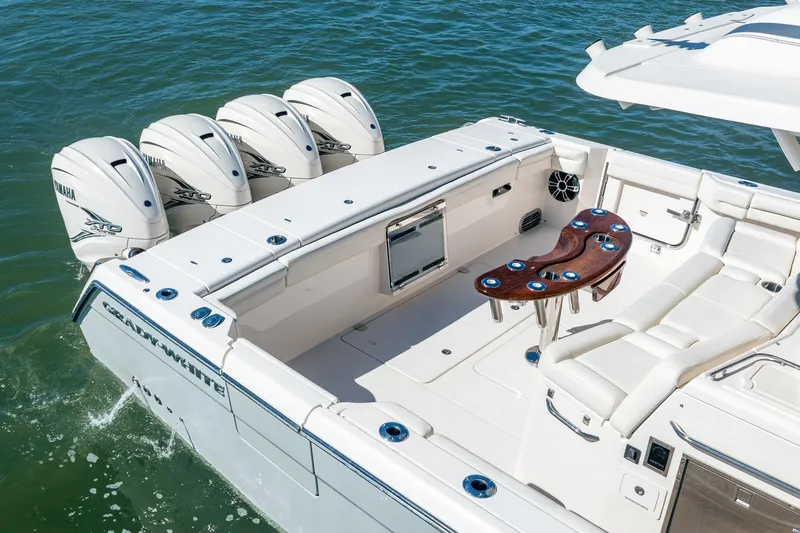 4 Reels Yacht Photos Pics 2021 Grady-White Canyon 456 boat with Yamaha engines, spacious deck, and seating area.