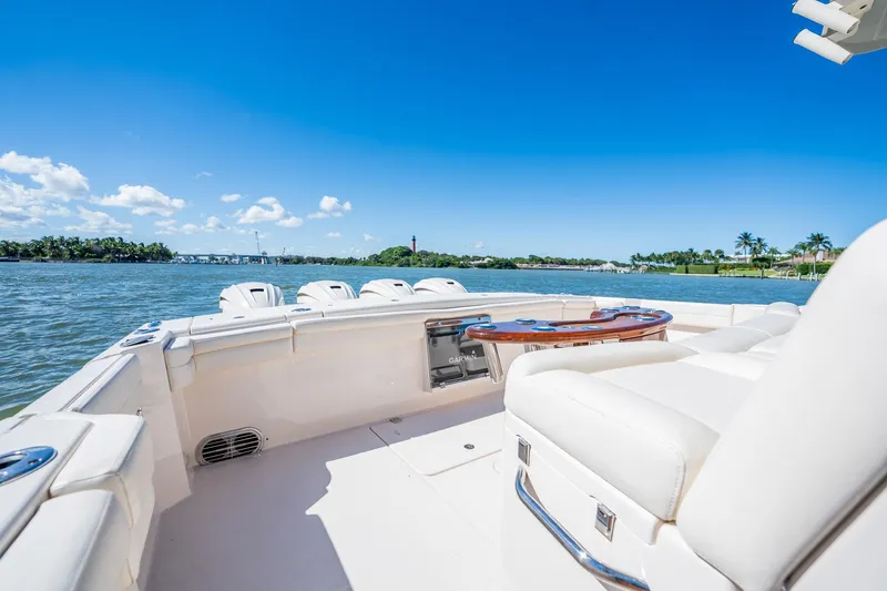 4 Reels Yacht Photos Pics 2021 Grady-White Canyon 456 boat interior with scenic water view.