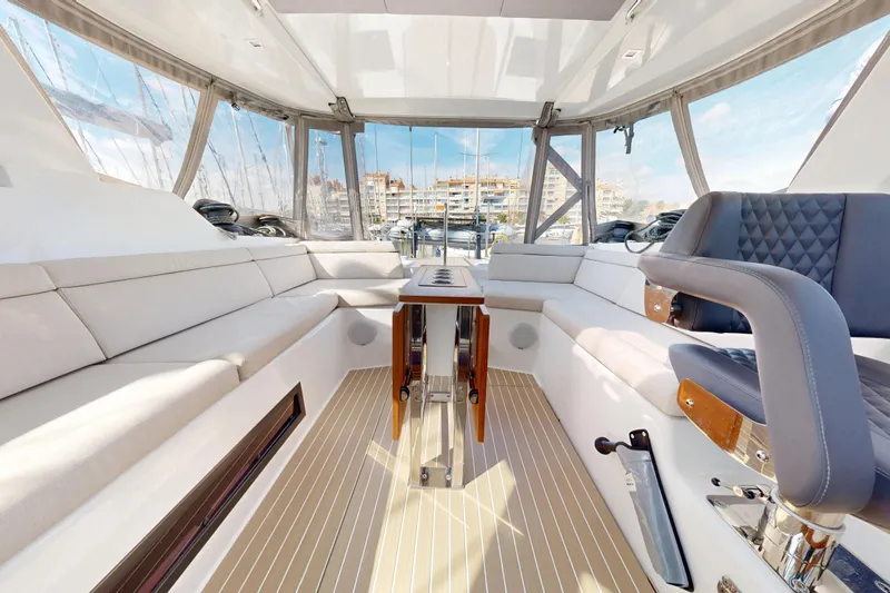  Yacht Photos Pics Luxurious interior of 2024 Amel 60 yacht with elegant seating and panoramic windows.
