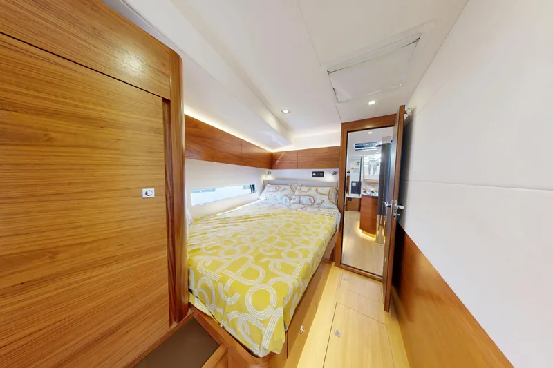  Yacht Photos Pics Luxurious cabin interior of 2024 Amel 60 yacht with wooden finishes and modern design.