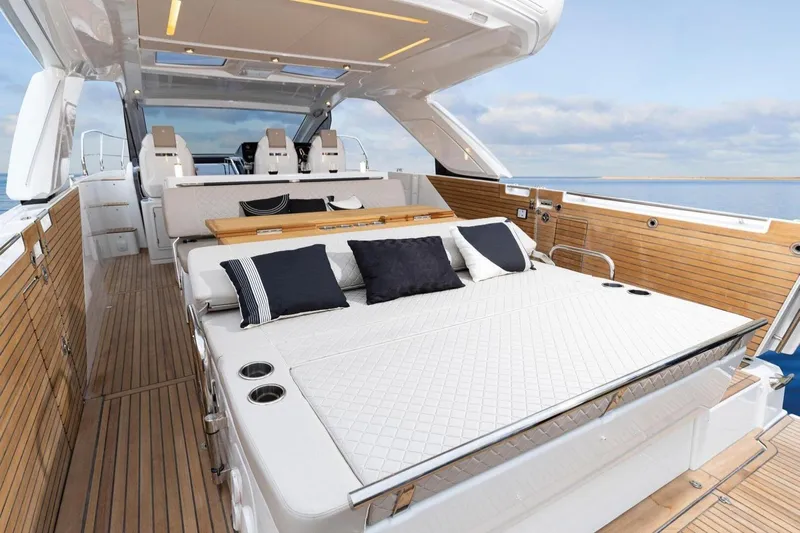  Yacht Photos Pics 2025 Jeanneau DB/43 IB yacht interior with luxurious seating and elegant wood finish.
