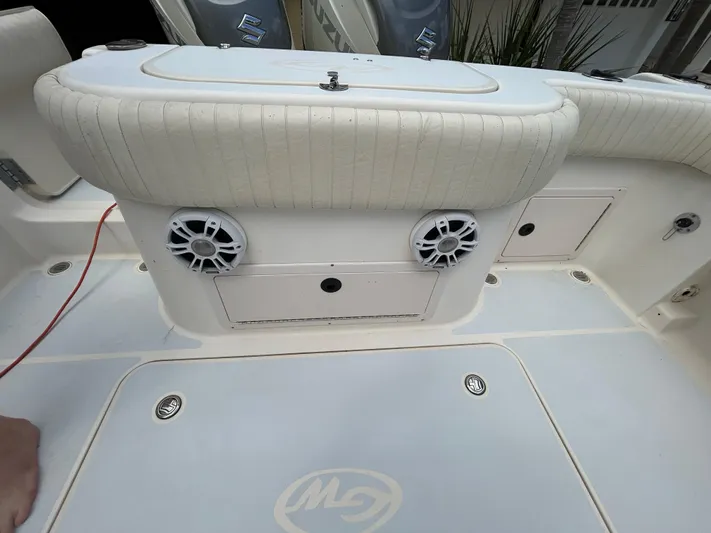  Yacht Photos Pics 2002 Grady-White 306 Bimini boat interior with speakers and storage compartments.