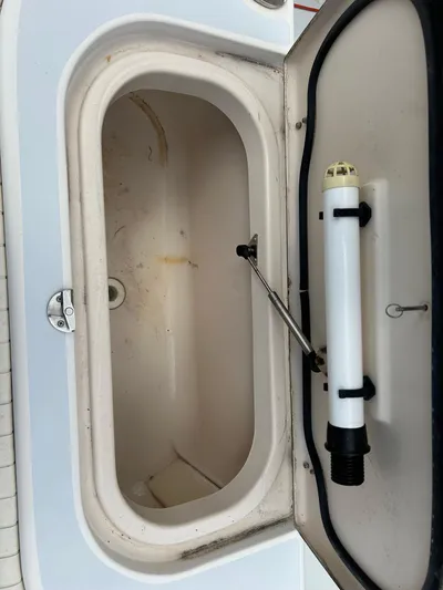  Yacht Photos Pics Open storage compartment on 2002 Grady-White 306 Bimini boat.