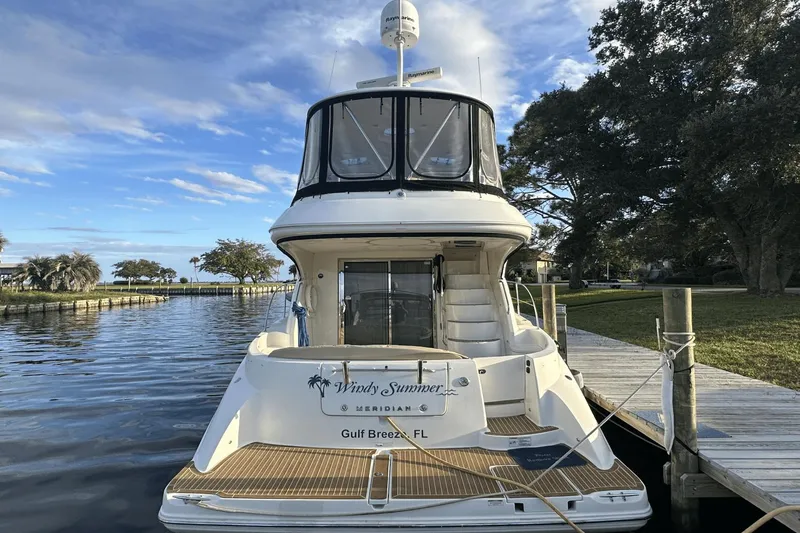  Yacht Photos Pics 2015 Meridian 441 Sedan yacht docked in Gulf Breeze, FL, under a clear blue sky.