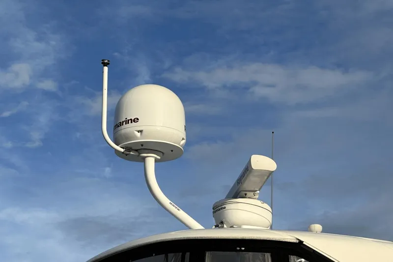  Yacht Photos Pics Radar and satellite equipment on a 2015 Meridian 441 Sedan against a blue sky.