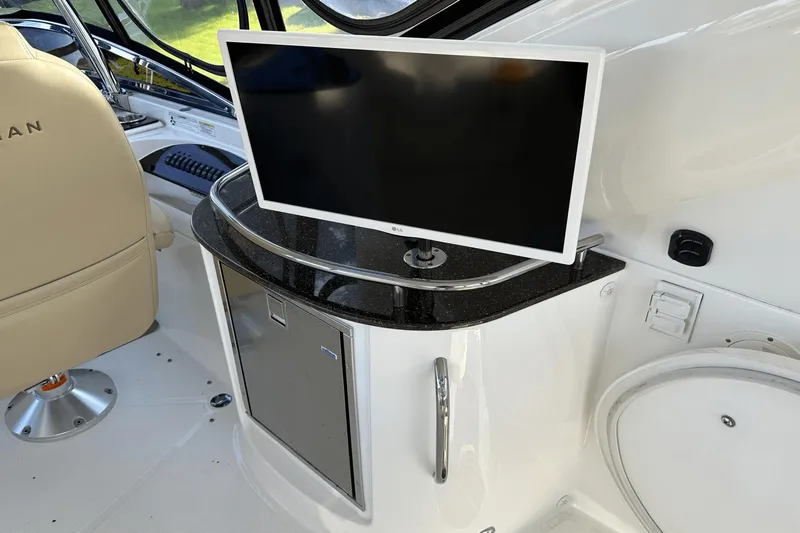  Yacht Photos Pics Interior of 2015 Meridian 441 Sedan with TV and control panel.