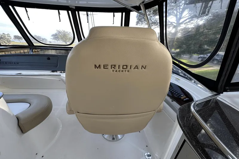  Yacht Photos Pics Interior of 2015 Meridian 441 Sedan yacht with beige seating and panoramic windows.