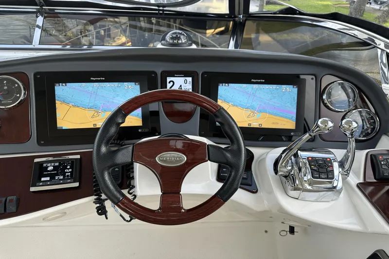  Yacht Photos Pics Helm of 2015 Meridian 441 Sedan with navigation screens and controls.