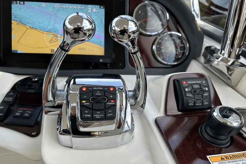  Yacht Photos Pics Control panel of a 2015 Meridian 441 Sedan yacht with navigation display and throttle levers.