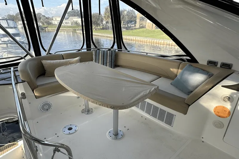  Yacht Photos Pics Luxurious interior of 2015 Meridian 441 Sedan yacht with elegant seating and table.