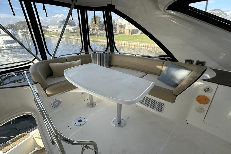  Yacht Photos Pics Luxurious interior of 2015 Meridian 441 Sedan yacht with elegant seating and table.