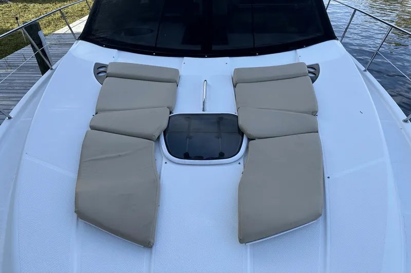  Yacht Photos Pics 2015 Meridian 441 Sedan yacht with beige sun pads on deck.