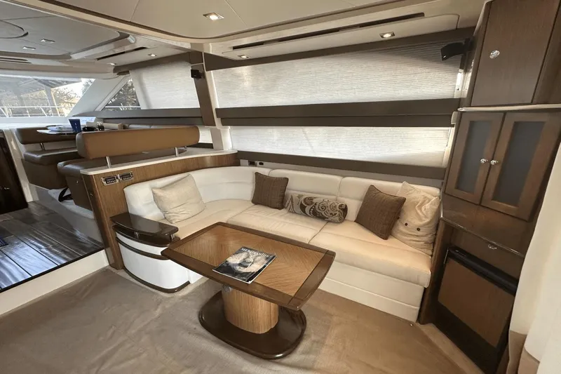  Yacht Photos Pics Luxurious interior of a 2015 Meridian 441 Sedan yacht with elegant seating and wooden accents.