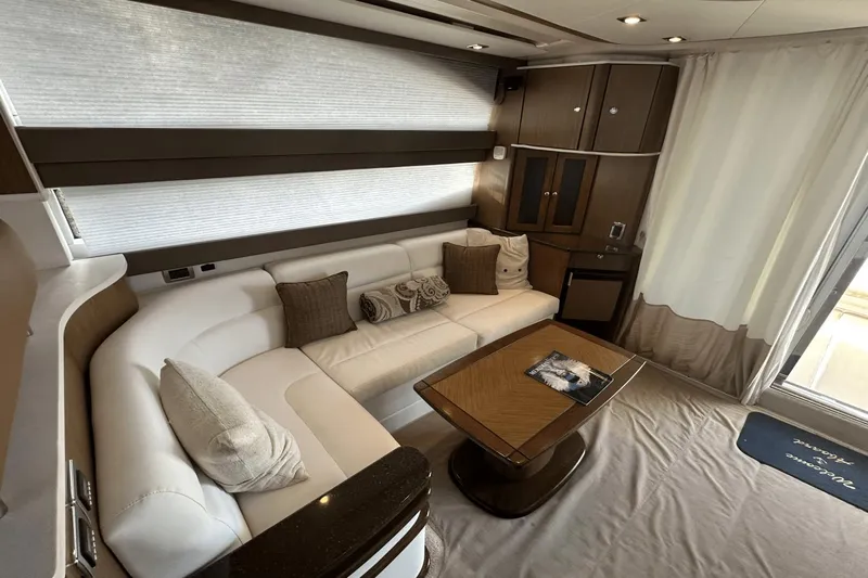  Yacht Photos Pics Luxurious interior of a 2015 Meridian 441 Sedan yacht with elegant seating and wooden accents.