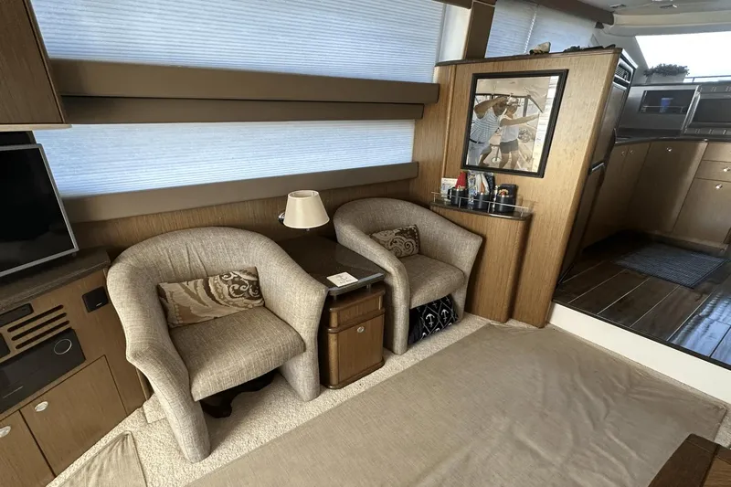  Yacht Photos Pics Interior of a 2015 Meridian 441 Sedan yacht with cozy seating and elegant decor.