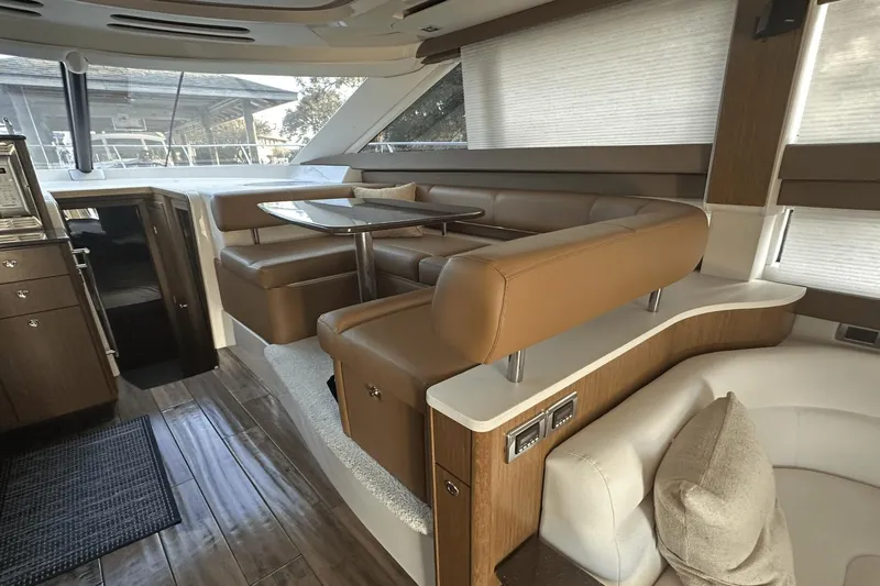  Yacht Photos Pics Luxurious interior of a 2015 Meridian 441 Sedan yacht with elegant seating and dining area.