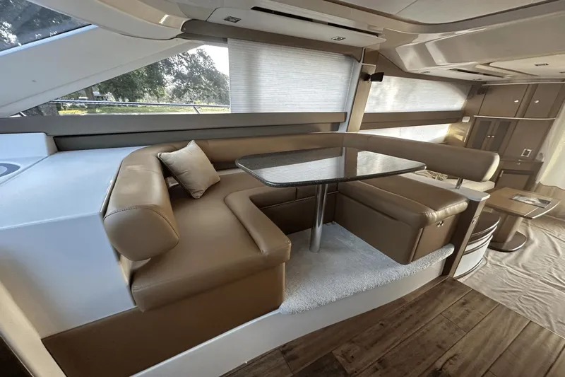  Yacht Photos Pics Luxurious interior of a 2015 Meridian 441 Sedan yacht with elegant seating and dining area.