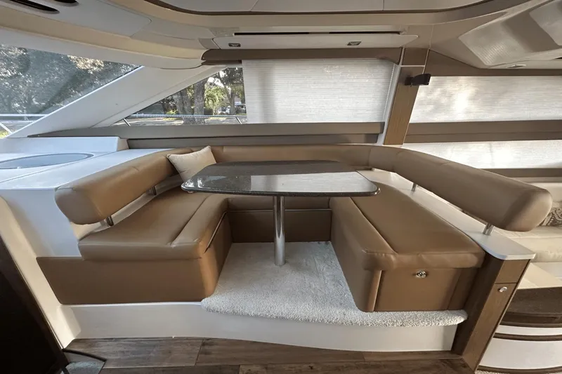  Yacht Photos Pics Luxurious interior of 2015 Meridian 441 Sedan yacht with elegant seating and table.