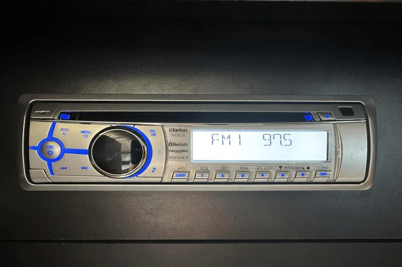  Yacht Photos Pics Clarion M303 stereo system in 2015 Meridian 441 Sedan, displaying FM 97.6 frequency.