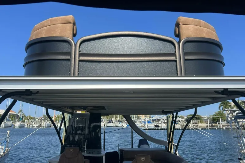  Yacht Photos Pics 2023 Premier 330 Escalante boat with rooftop seating, docked at marina.