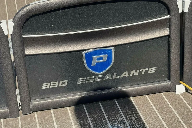  Yacht Photos Pics 2023 Premier 330 Escalante logo on a black panel with blue emblem.