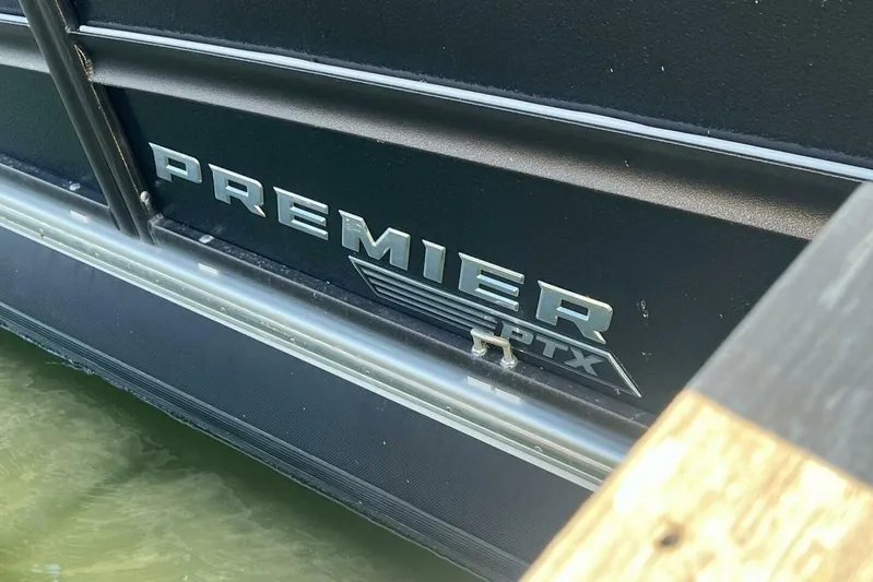  Yacht Photos Pics 2023 Premier 330 Escalante PTX logo on boat exterior near water.