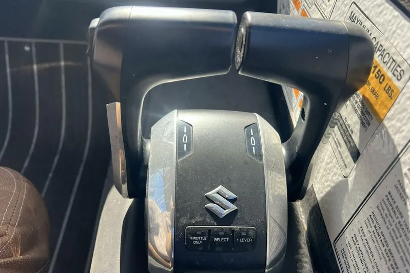  Yacht Photos Pics Throttle control lever of a 2023 Premier 330 Escalante boat, featuring Suzuki branding.