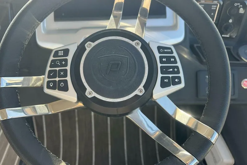  Yacht Photos Pics Steering wheel of 2023 Premier 330 Escalante with integrated controls and logo.