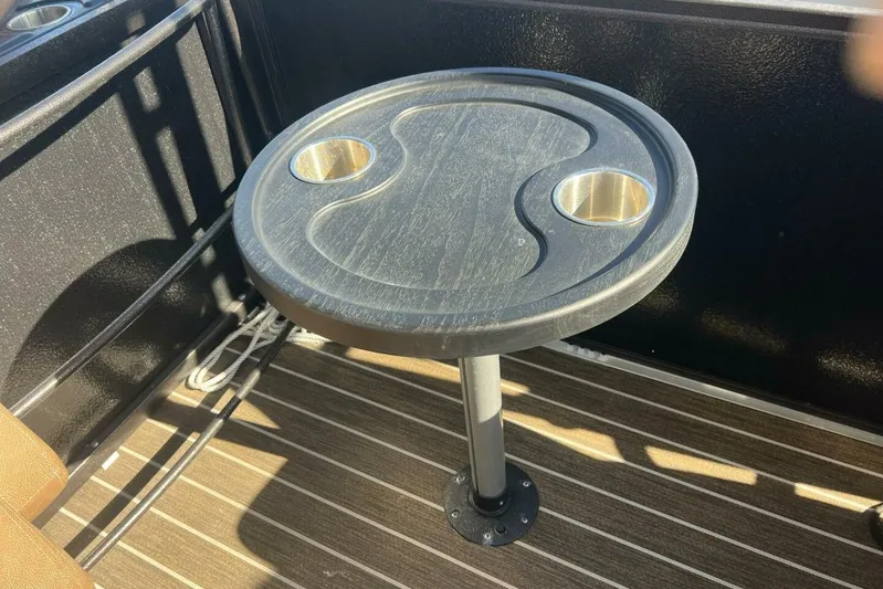  Yacht Photos Pics Round table with cup holders on a 2023 Premier 330 Escalante boat deck.