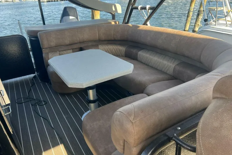  Yacht Photos Pics Luxurious seating area on 2023 Premier 330 Escalante boat with water view.