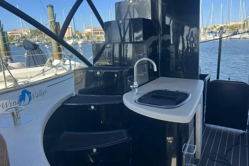 Yacht Photos Pics 2023 Premier 330 Escalante boat interior with sink and steps, docked at marina.