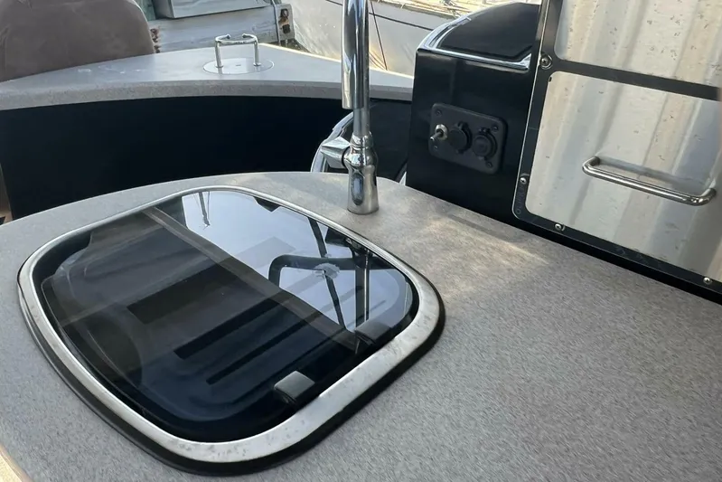  Yacht Photos Pics 2023 Premier 330 Escalante boat interior with sleek countertop and modern fixtures.