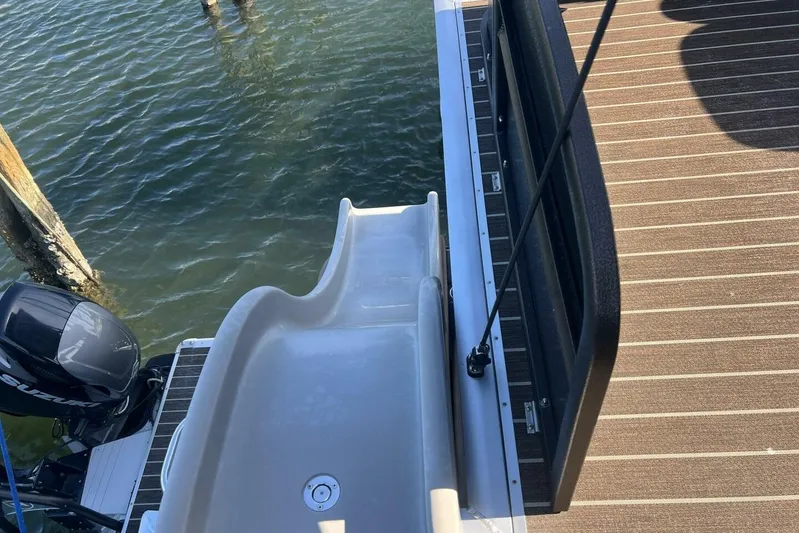  Yacht Photos Pics 2023 Premier 330 Escalante boat with slide and motor on water.