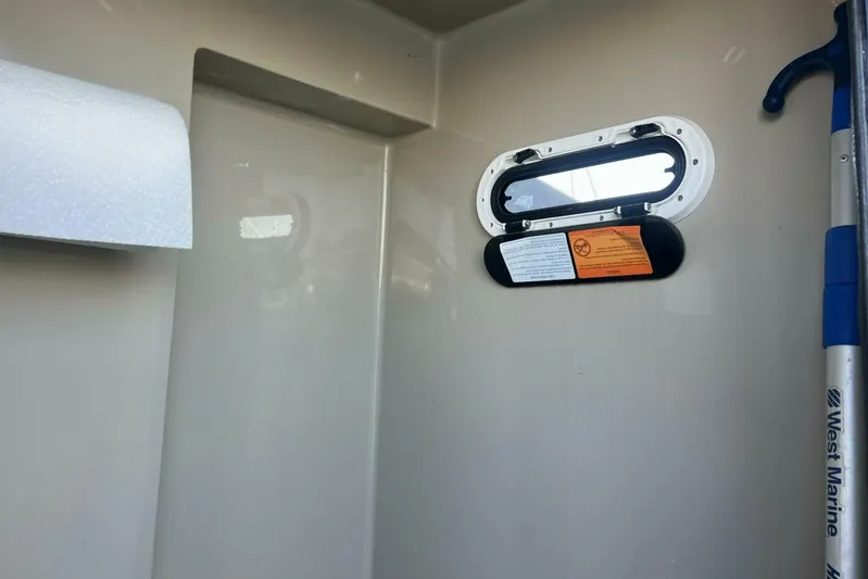  Yacht Photos Pics Interior of 2023 Premier 330 Escalante boat with window and marine equipment.