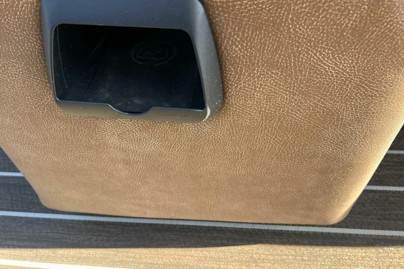  Yacht Photos Pics Brown textured surface with a black compartment in a 2023 Premier 330 Escalante.