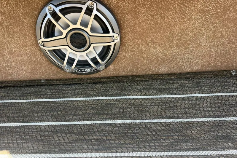  Yacht Photos Pics Speaker on 2023 Premier 330 Escalante boat with textured flooring and leather panel.