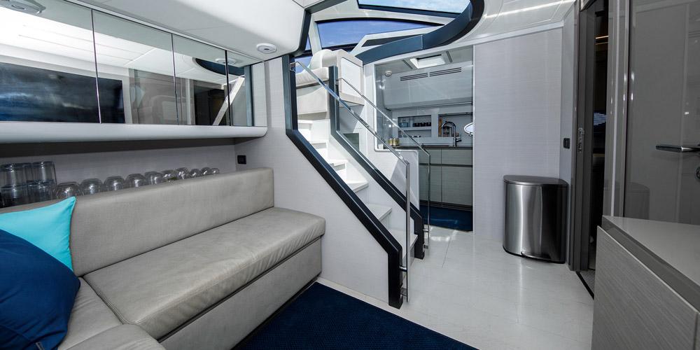 Luxurious interior of a 2015 Pershing 62' yacht with modern design and elegant furnishings.