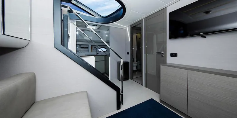  Yacht Photos Pics Interior of 2015 Pershing 62' yacht, featuring modern design and sleek furnishings.