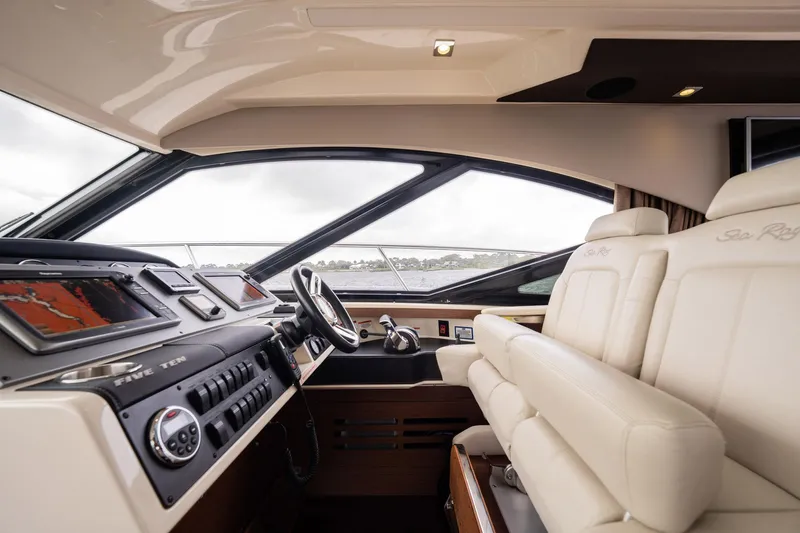 Sol E Mar IV Yacht Photos Pics 2015 Sea Ray 510 Sundancer helm with luxurious leather seating and advanced navigation controls.