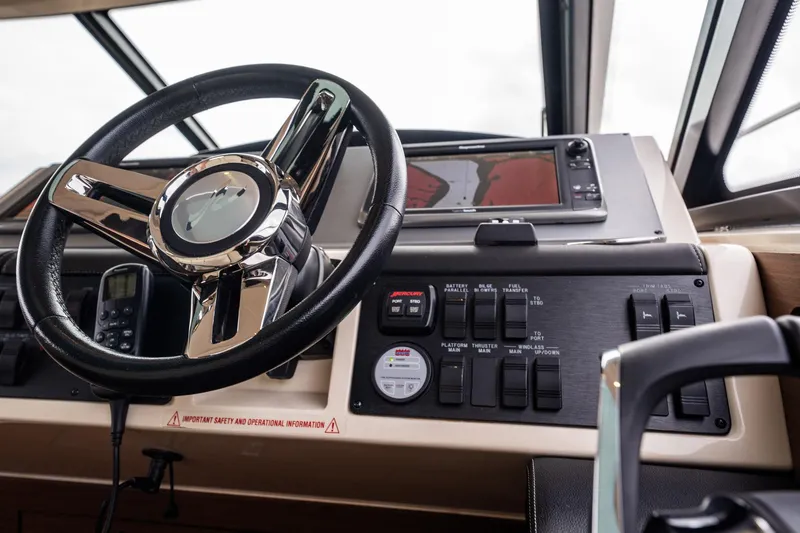 Sol E Mar IV Yacht Photos Pics Helm of 2015 Sea Ray 510 Sundancer with steering wheel and control panel.