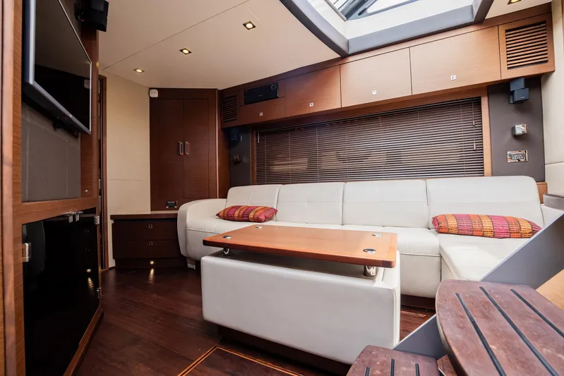 Sol E Mar IV Yacht Photos Pics Luxurious interior of 2015 Sea Ray 510 Sundancer yacht with modern furnishings and skylight.