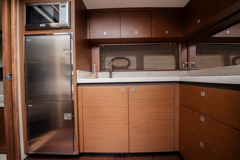 Sol E Mar IV Yacht Photos Pics Luxurious kitchen interior of 2015 Sea Ray 510 Sundancer yacht with modern appliances.