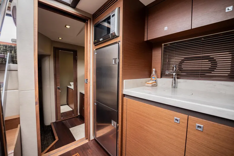 Sol E Mar IV Yacht Photos Pics Luxurious interior of 2015 Sea Ray 510 Sundancer yacht with modern kitchen amenities.