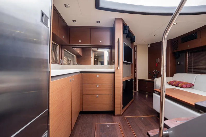 Sol E Mar IV Yacht Photos Pics Luxurious interior of 2015 Sea Ray 510 Sundancer yacht with modern kitchen and seating area.