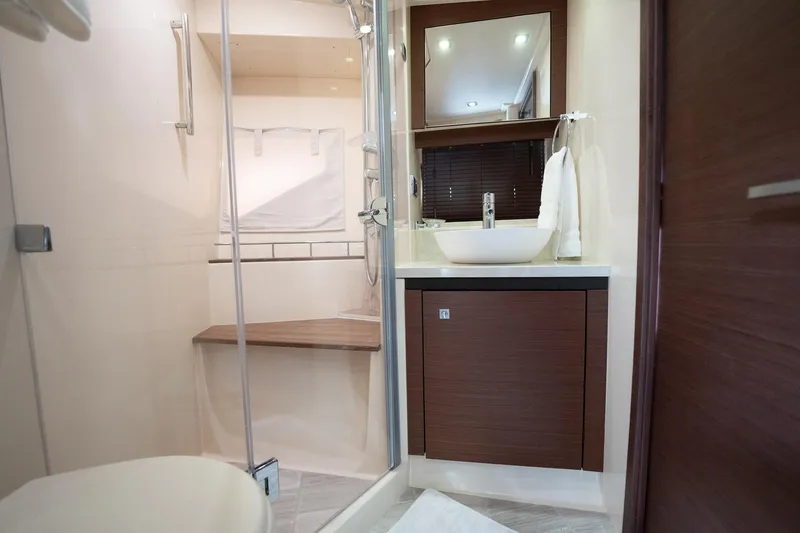 Sol E Mar IV Yacht Photos Pics Luxurious bathroom interior of 2015 Sea Ray 510 Sundancer yacht with modern fixtures.