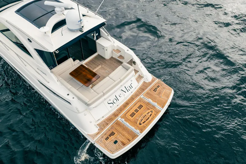 Sol E Mar IV Yacht Photos Pics 2015 Sea Ray 510 Sundancer yacht cruising on water, featuring elegant deck and seating area.