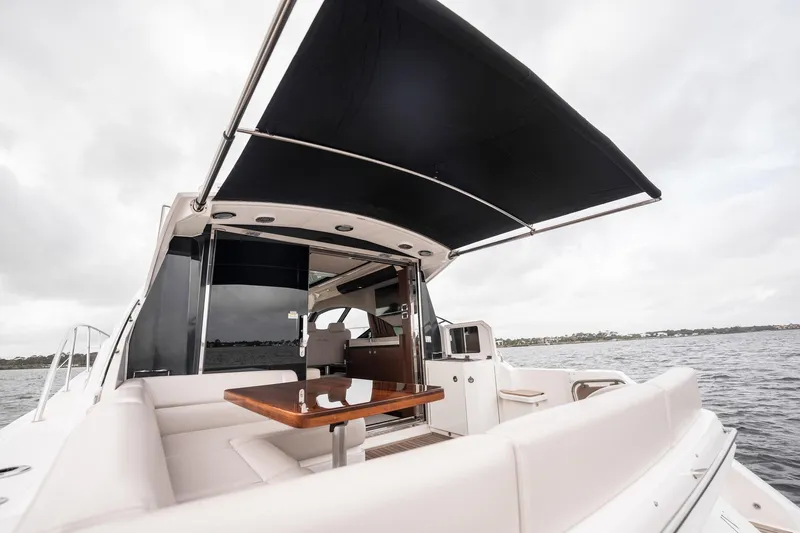 Sol E Mar IV Yacht Photos Pics 2015 Sea Ray 510 Sundancer yacht with spacious deck and seating area on water.