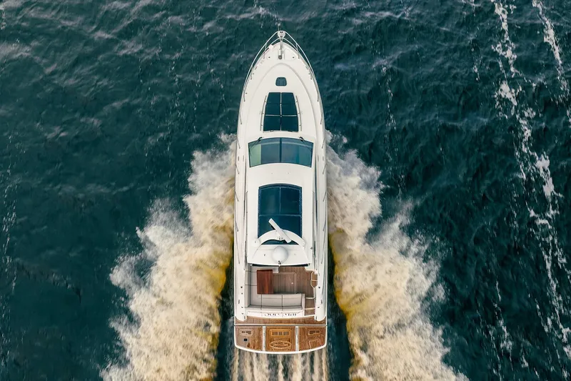 Sol E Mar IV Yacht Photos Pics Aerial view of 2015 Sea Ray 510 Sundancer yacht cruising on water.