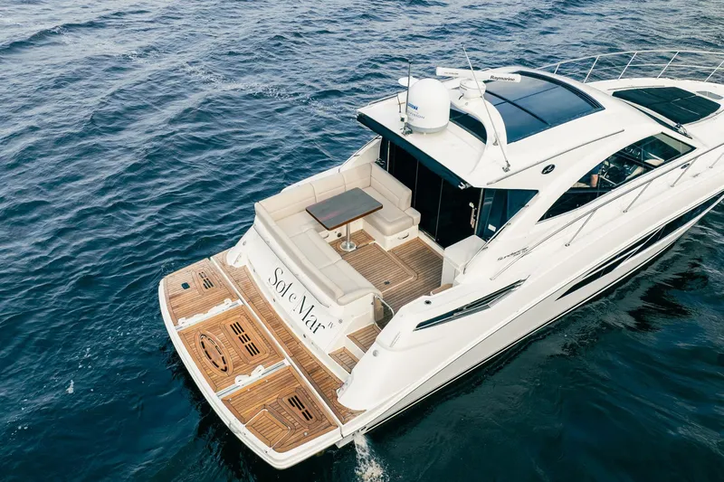 Sol E Mar IV Yacht Photos Pics 2015 Sea Ray 510 Sundancer yacht cruising on open water, featuring a spacious deck.